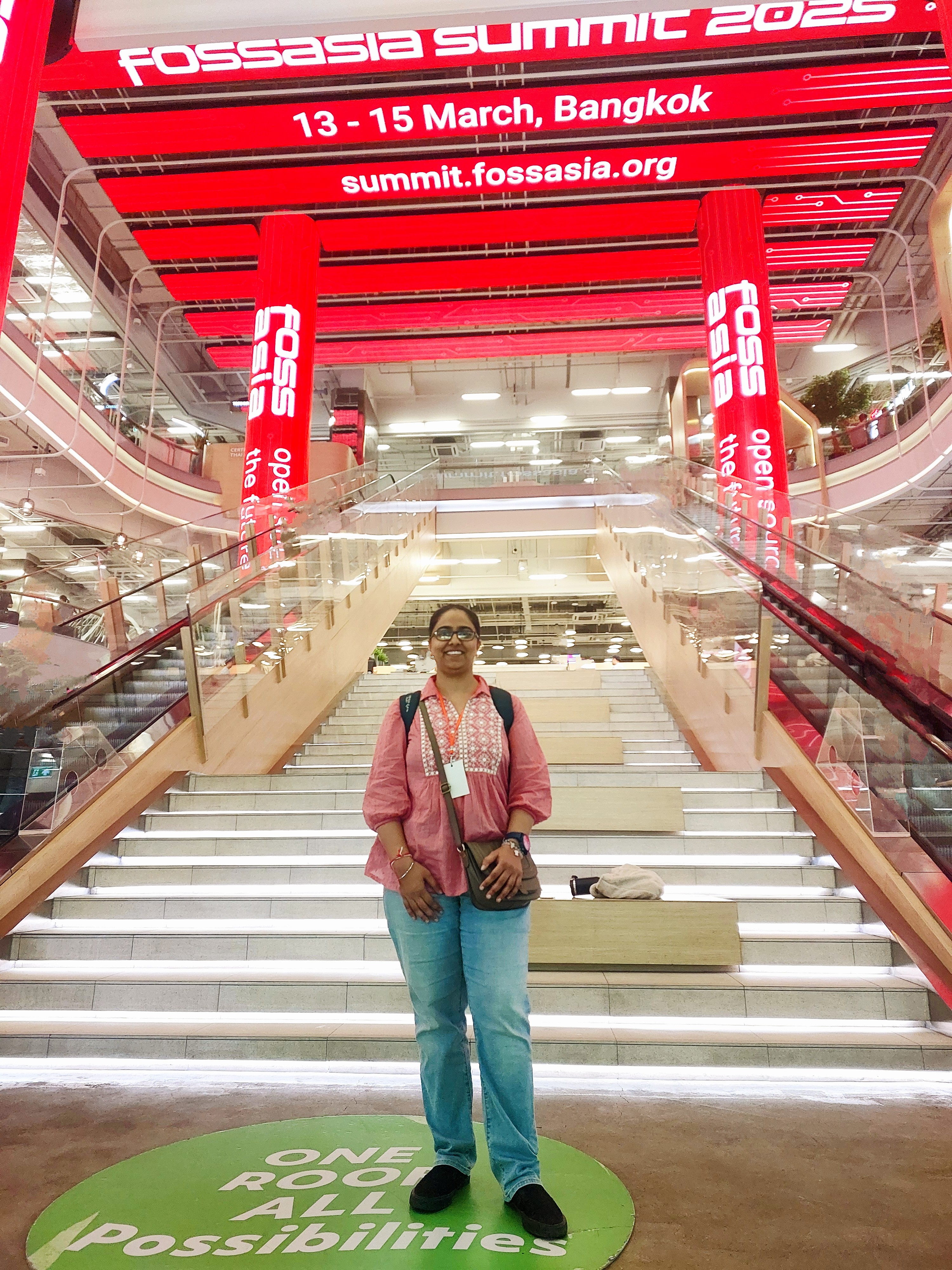 Me against the backdrop of the live LED screens at the conference venue True Digital Park.